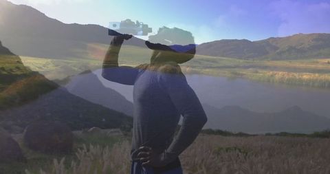 Athletic Explorer Hydrating in Mountain Valley, Celebrating Nature