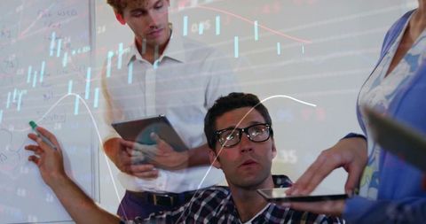 Business Team Analyzing Data with Technology and Charts in Office