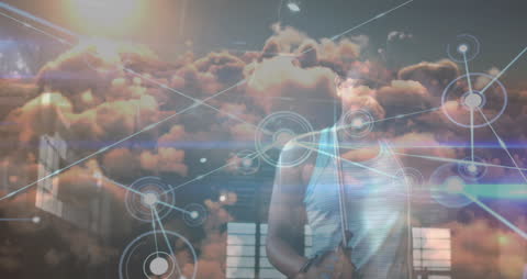 Man Integrating Technology with Cloud Network Connections Overlay