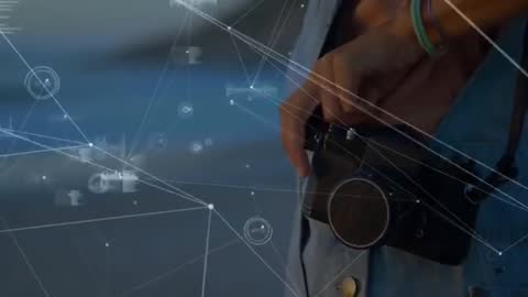 Hand Holding Camera with Digital Network Overlay
