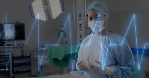 Healthcare Professional in Surgical Attire with Digital Cardiograph - Download Free Stock Images Pikwizard.com
