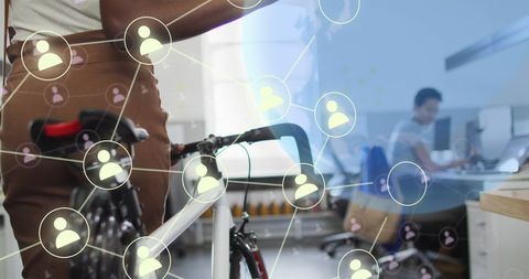 Digital Networking in Modern Office with Bicycle in Focus