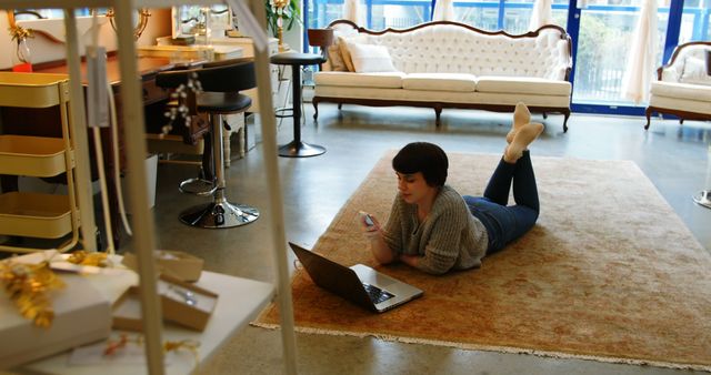 Woman Relaxing on Rug, Working from Home with Laptop and Phone - Download Free Stock Images Pikwizard.com