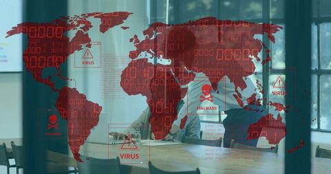 Business team reviewing global malware map on glass highlighting cybersecurity threats