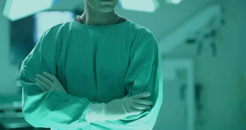Confident Surgeon in Operating Room with Crossed Arms
