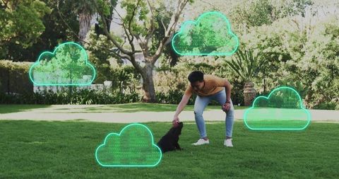 Man petting small dog on lawn with neon cloud network icons representing cloud storage