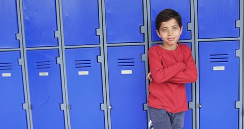 Confident Young Boy Posing Against School Lockers Outdoors - Download Free Stock Images Pikwizard.com
