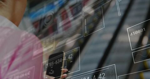 Modern Businesswoman Analyzing Digital Data on Smartphone in Urban Interior