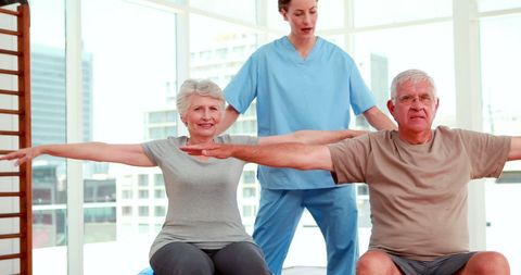 Senior Citizens Engaging in Exercise with Physiotherapist