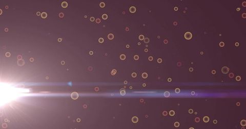 Bokeh Lights with Lens Flare Creating Energetic Abstract Background