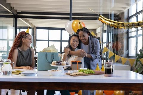 Diverse Businesswomen Celebrating Birthday in Modern Office
