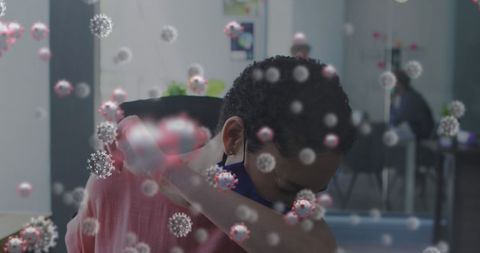 Office Worker Sneezing with COVID-19 Virus Particles Visualized