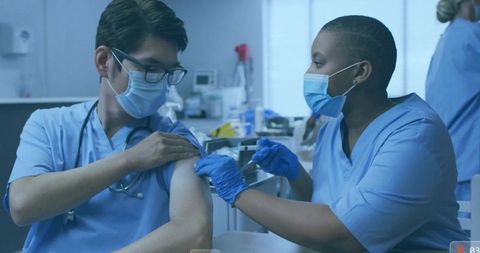 Healthcare Professionals Providing Vaccine in Medical Clinic