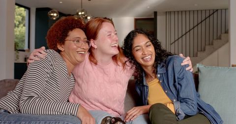 Diverse Friends Relaxing with Gaming Fun