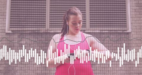 Plus size woman analyzing fitness data in urban environment