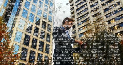 Professional Engages with Data Streams on City Street