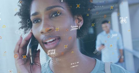 African American Woman Engaged in Smartphone Communication Overlayed with Data Elements