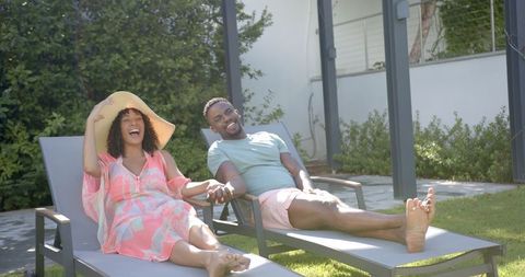 Happy Couple Relaxing Outdoors Beside Poolside Lounger - Download Free Stock Images Pikwizard.com
