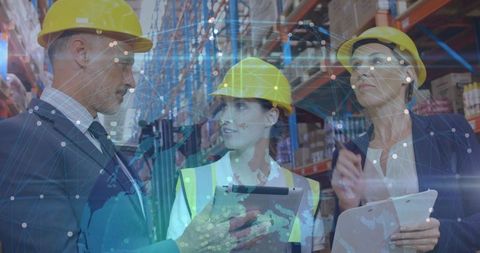 Warehouse Team Inspecting Inventory with Digital Network Overlay, Safety Helmets, Tablets