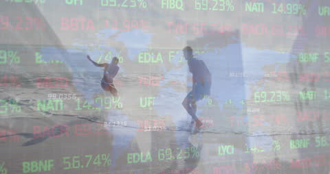 Couple Enjoying Beach with Stock Market Overlay