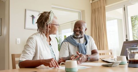 Senior African American Couple Discussing Finances at Home