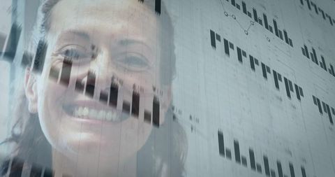 Smiling mid-adult businesswoman with data visualization overlay and analytics graphs