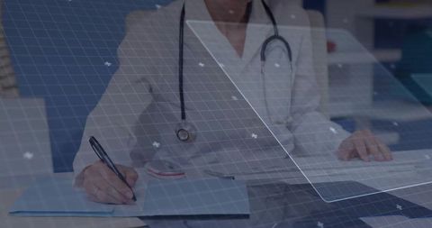 Doctor writing medical notes in modern office with technology overlay
