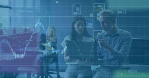 Business Team Analyzing Stock Trends on Laptop in Office