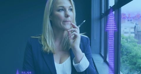 Businesswoman contemplates innovative digital strategy