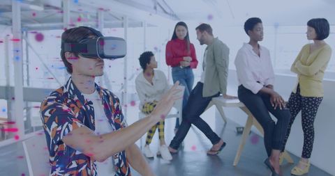 Diverse Team Discussing with Virtual Reality in Modern Office