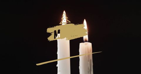 Christmas celebration with lit candles against black background