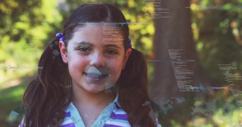 Smiling girl wearing purple collared shirt and pigtails outdoors with digital code overlay