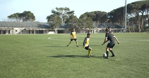 Intense Soccer Match with Focus on Player and Ball Action
