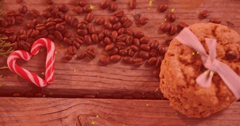 Rustic harmony: coffee beans, candy cane heart, and ribbon-tied cookies