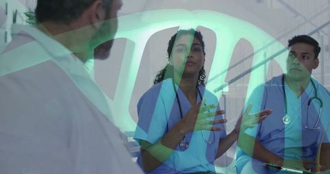 Medical team discussing healthcare plans in hospital corridor