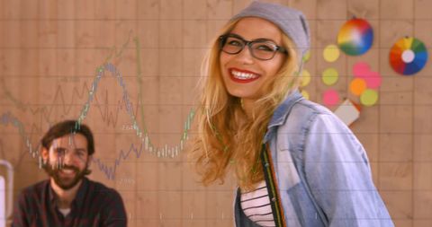 Creative team analyzing financial growth with digital graphics