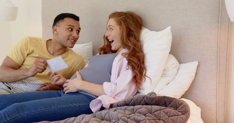 Happy Couple Celebrating Pregnancy with Ultrasound