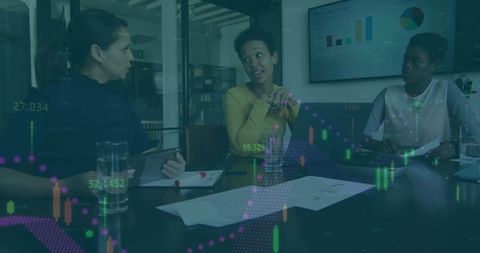 Women Leading Data-Driven Meeting Around Table with Laptop Charts and Infographics