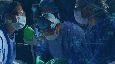 Surgeons Working with Digital Network Interface in Operating Room