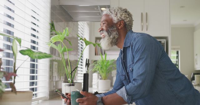 Image of african american senior man drinking coffee. retirement lifestyle, spending time alone at home concept digitally generated image.