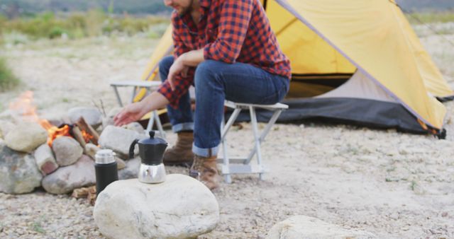 Man Camping and Making Coffee on Campfire - Download Free Stock Images Pikwizard.com