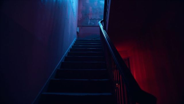 Moody urban staircase with dramatic lighting