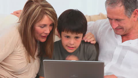 Grandparents Enjoying Laptop Time with Their Grandson