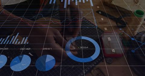 Technician assembling electronics while blue analytics overlay workbench for precision