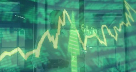 Businessman Tracking Financial Graphs on Smartphone in Modern Office