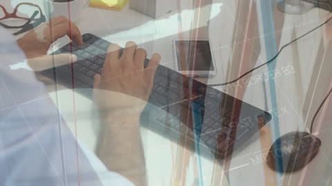 Businessman Using Keyboard with Digital Financial Overlays