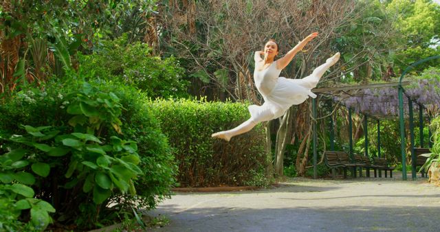 Elegant Ballet Dancer Leaping Gracefully Outdoors - Download Free Stock Images Pikwizard.com