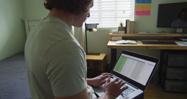 Young Man Working Remotely at Home Office Desk - Download Free Stock Images Pikwizard.com