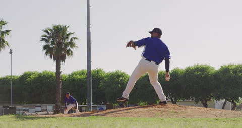 Pitcher in Motion on Sunny Baseball Field