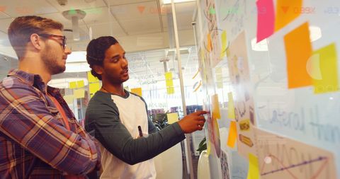 Multicultural Team Brainstorming with Data Projections in Modern Office - Download Free Stock Images Pikwizard.com